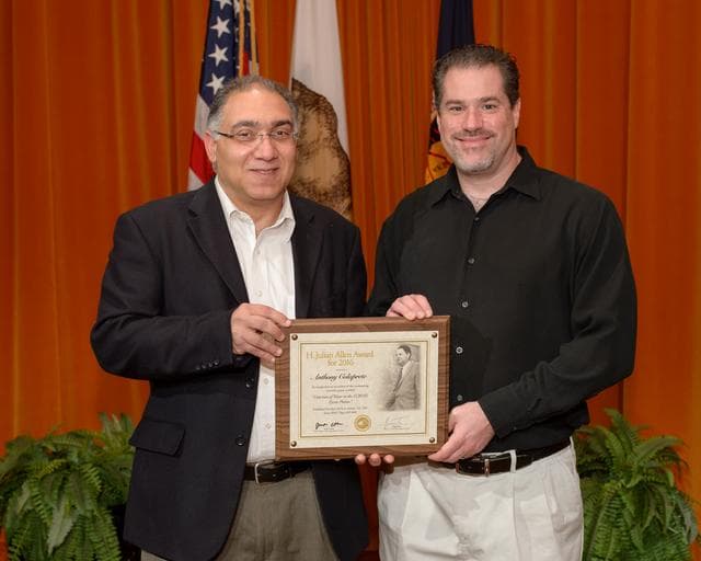 NASA image: Dr. Jacob Cohen presents the H. Julian Allen award to Anthony Colaprete.