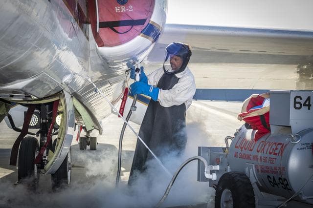 NASA image: ER-2 aircraft expert handles liquid oxygen for airborne science mission