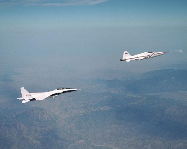 NASA image: NASA's F-15B research testbed jet from the NASA Dryden Flight Research Center flew in the supersonic shockwave of a Northrop Grumman Corp. modified F-5E in support of the Shaped Sonic Boom Demonstration (SSBD) project, which is part of DARPA's Quiet Supers