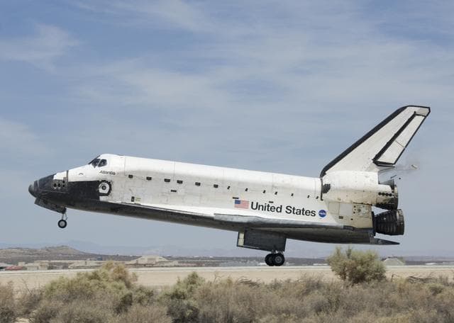 NASA image: Space Shuttle Atlantis starts to deploy its braking parachute following touchdown at Edwards Air Force Base, California, on June 22, 2007