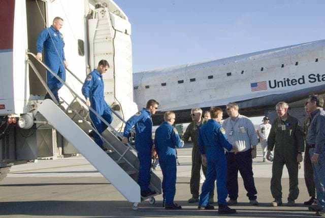 NASA image: Air Force and NASA officials greet the STS-126 crew as they exit the Crew Transport Vehicle after landing the shuttle Endeavour at Edwards Air Force Base