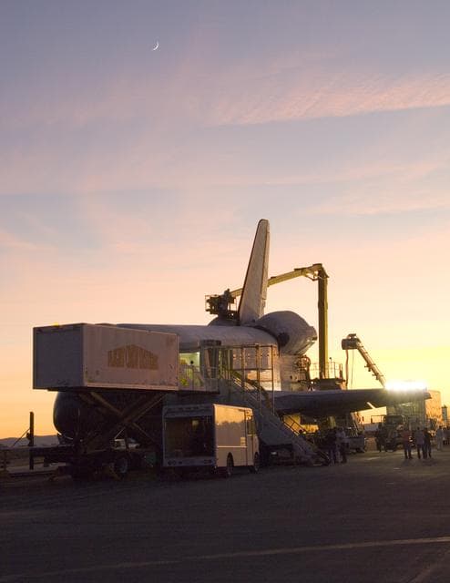 NASA image: Its STS-126 mission over, Space Shuttle Endeavour is surrounded by recovery equipment before being towed off the Edwards Air Force Base runway