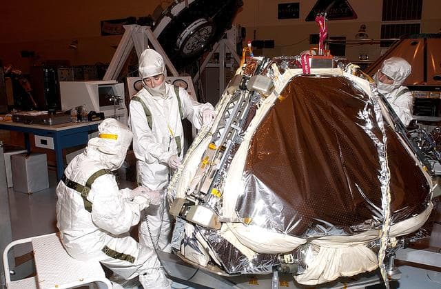 NASA image: KENNEDY SPACE CENTER, FLA. - On Mars Exploration Rover 1 (MER-1) , air bags are installed on the lander.  The airbags will inflate to cushion the landing of the spacecraft on the surface of Mars.  When it stops bouncing and rolling, the airbags will deflate and retract, the petals will open to bring the lander to an upright position, and the rover will be exposed.  NASA's twin Mars Exploration Rovers are designed to study the history of water on Mars. These robotic geologists are equipped with a robotic arm, a drilling tool, three spectrometers, and four pairs of cameras that allow them to have a human-like, 3D view of the terrain. Each rover could travel as far as 100 meters in one day to act as Mars scientists' eyes and hands, exploring an environment where humans can't yet go.  MER-1 is scheduled to launch June 25 as MER-B aboard a Delta II rocket from Cape Canaveral Air Force Station.