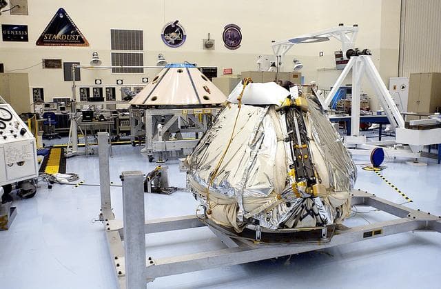 NASA image: KENNEDY SPACE CENTER, FLA. -  The Mars Exploration Rover 1 (MER-1) is seen after installation of the air bags on the outside of the lander.  The airbags will inflate to cushion the landing of the spacecraft on the surface of Mars.  When it stops bouncing and rolling, the airbags will deflate and retract, the petals will open to bring the lander to an upright position, and the rover will be exposed.  NASA's twin Mars Exploration Rovers are designed to study the history of water on Mars. These robotic geologists are equipped with a robotic arm, a drilling tool, three spectrometers, and four pairs of cameras that allow them to have a human-like, 3D view of the terrain. Each rover could travel as far as 100 meters in one day to act as Mars scientists' eyes and hands, exploring an environment where humans can't yet go.  MER-1 is scheduled to launch June 25 as MER-B aboard a Delta II rocket from Cape Canaveral Air Force Station.