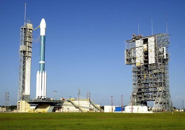 NASA image: KENNEDY SPACE CENTER, FLA. -    The launch tower (right) on Launch Complex 17-A, Cape Canaveral Air Force Station, has been rolled back from the Boeing Delta II rocket and its Mars Exploration Rover (MER-A) payload (left) in preparation for a second attempt at launch.  The first attempt on June 8, 2003, was scrubbed due to bad weather in the vicinity.  MER-A is the first of two rovers being launched to Mars.  When the two rovers arrive at Mars in 2004, they will bounce to airbag-cushioned landings at sites offering a balance of favorable conditions for safe landings and interesting science. The rovers see sharper images, can explore farther and examine rocks better than anything that has ever landed on Mars.  The designated site for MER-A mission is Gusev Crater, which appears to have been a crater lake.  The second rover, MER-B, is scheduled to launch June 25.