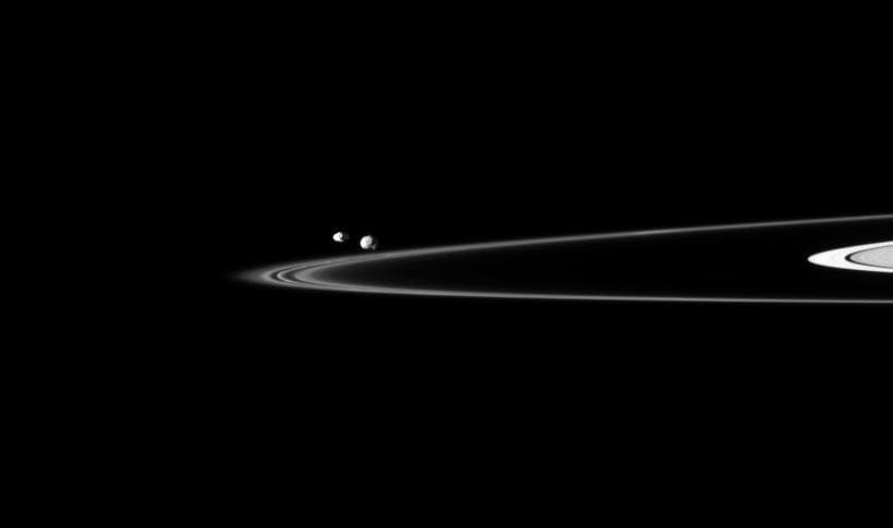 NASA image: Petite Pair Beyond Rings