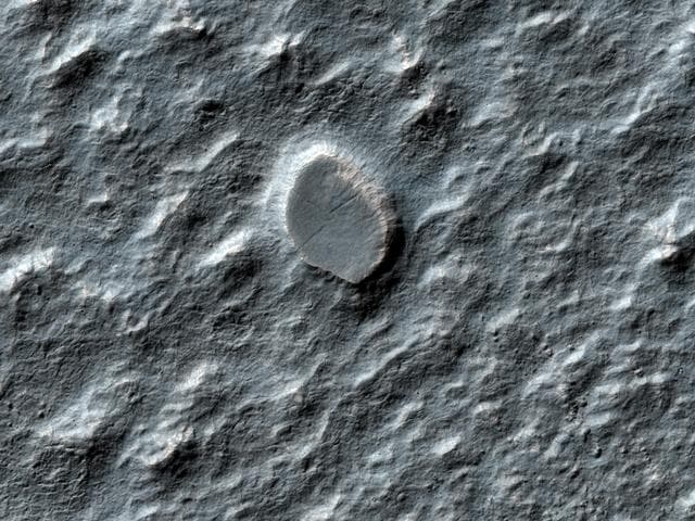 NASA image: Craters on an Ice-Rich Débris Apron