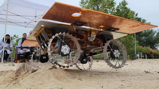 NASA image: CADRE Mini Rover Drives Over a Rock