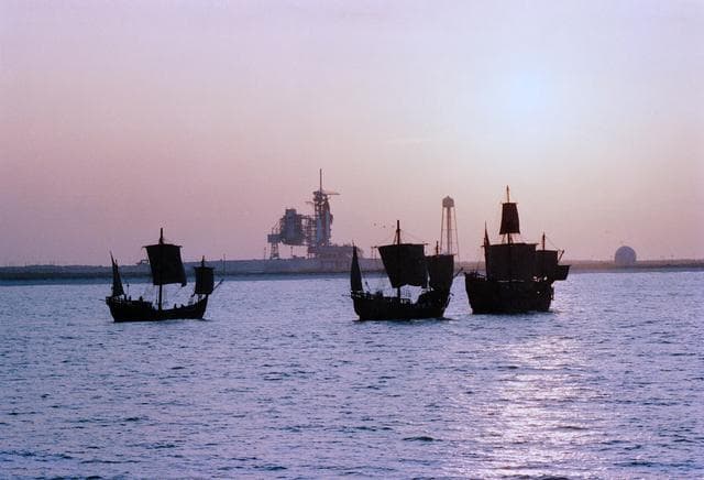 NASA image: Replicas of the Santa Maria, Nina, Pinta sail by OV-105 on KSC LC Pad 39B