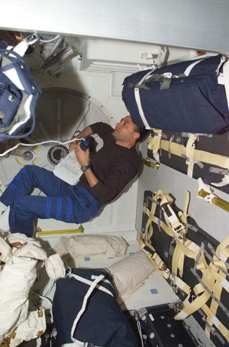 NASA image: PLT Polansky with microphone on middeck