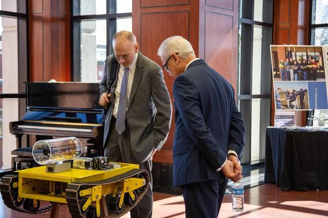NASA image: NASA's Douglas Terrier and David Steitz Investigate a Rover at Arkansas' Harding University